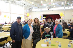 Senior Director Diana Dominick with attendees at the Spring Breakfast Bingo April 12, 2023