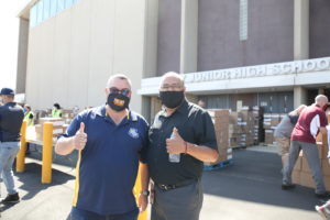 School District 99 Board Chairman Tom Tomschin and District 99 Supt. Rudy Hernandez distrubuting food to needy families at Unity Junior High school Thursday June 25, 2020. Photo courtesy of the Town of Cicero
