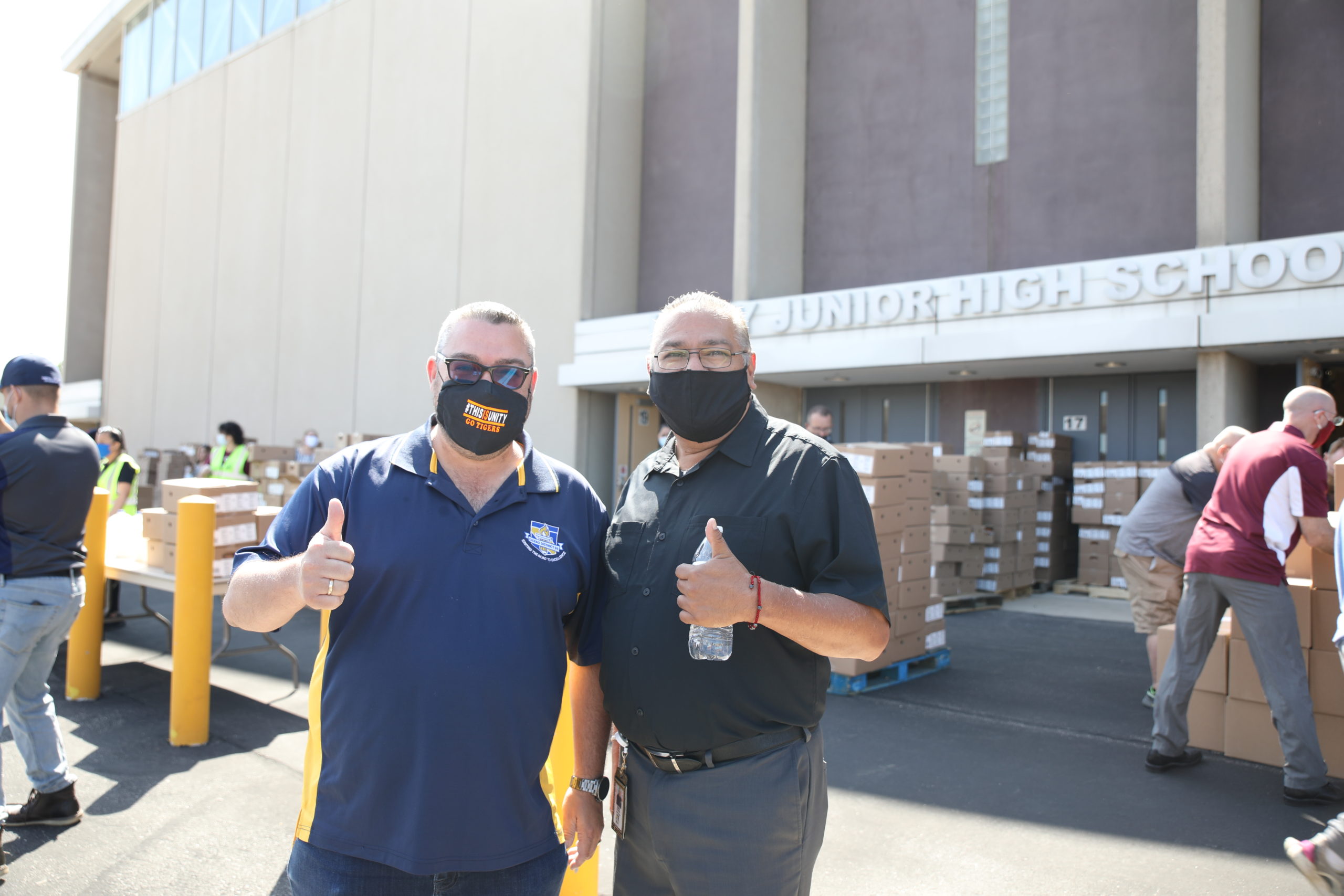 School District 99 Board Chairman Tom Tomschin and District 99 Supt. Rudy Hernandez distributing food to needy families at Unity Junior High school Thursday June 25, 2020. Photo courtesy of the Town of Cicero