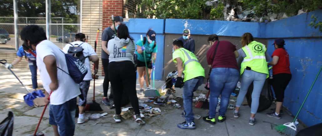 Volunteers help cleanup Cicero street one June 2, 2020 following the George Floyd protests