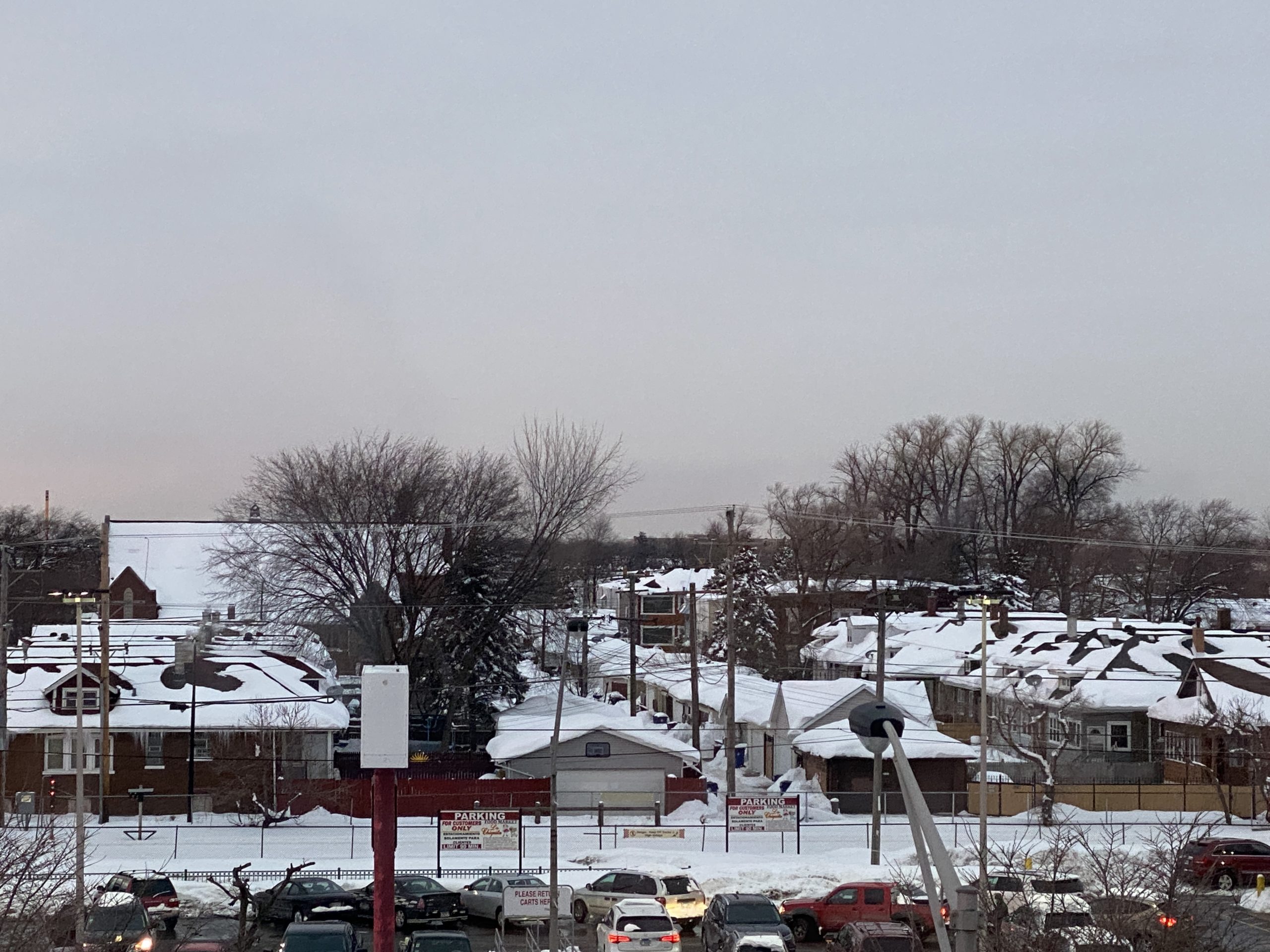 View of Cicero homes with snow