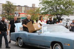 President Larry Dominick and Mrs Dominick lead the parade handing out treats to children and families along the 53rd Annual Houby Day Parade Sunday Oct. 10, 2021