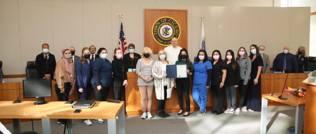 The Town of Cicero honored Cicero Health Commissioner Sue Grazzini on Tuesday. Jan. 11, 2022. Grazzini poses with Cicero officials and the Health Department staff