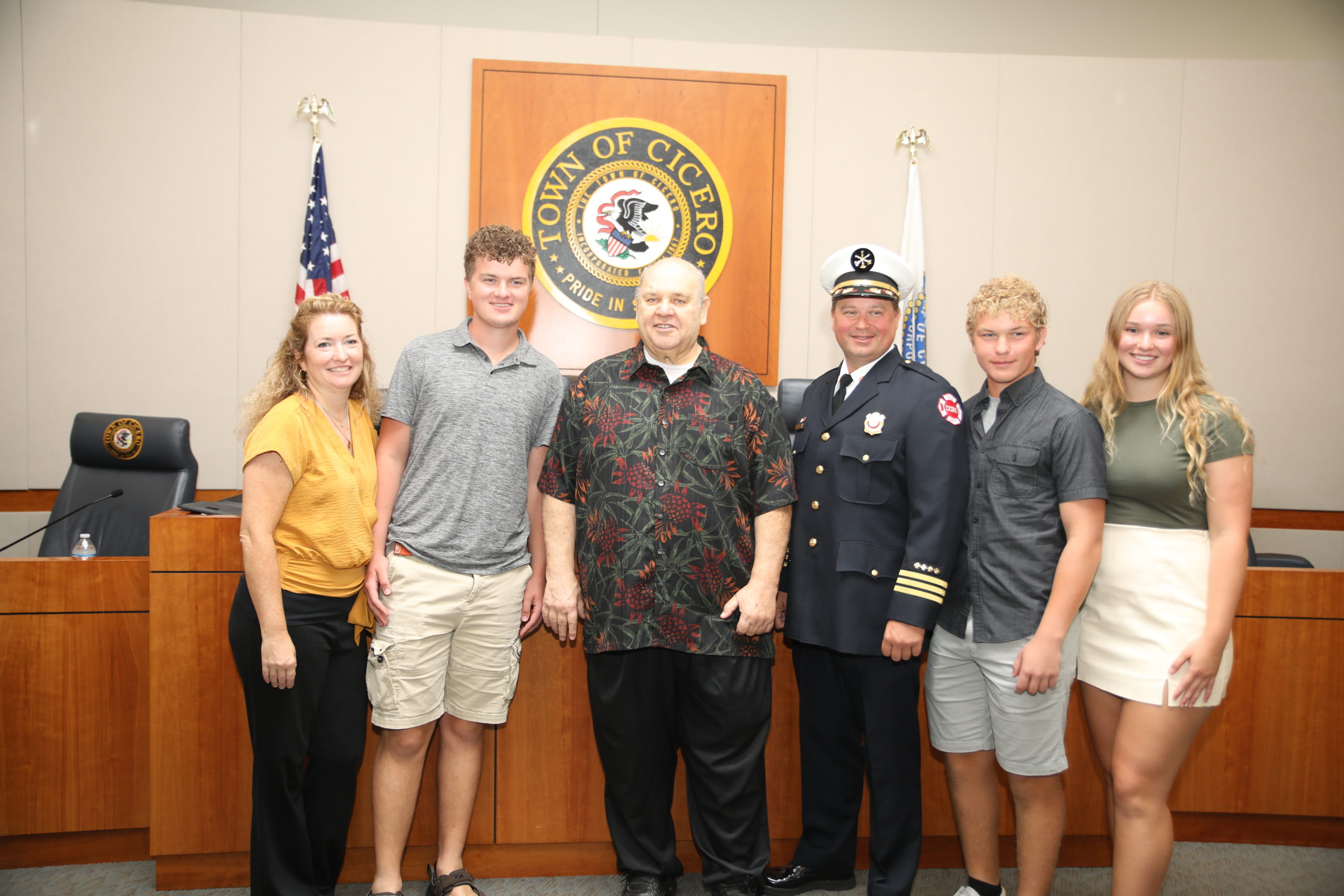 Cicero Deputy Fire CHief Jonathan Sochacki with his family and President Larry Dominick.