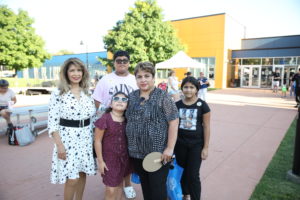 Cicero Senior Center Director Diana Dominick and Cicero Clerk Maria Punzo-Arias with children who attended the National Night Out celebration on August 2, 2022