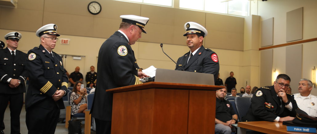 Cicero Fire Chief Jeffrey Penzkofer administers the oath to Lt. James Guido who was promoted to the rank of Assistant Fire Chief if Fire Prevention at the Cicero Board meeting August 23, 2022