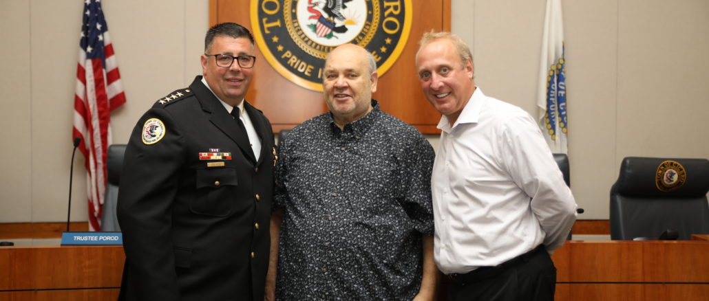 Retiring Cicero Police Chief Jerry Chlada Jr., poses with Town President Larry Dominick and Stickney Police Chief James Sassetti following his announcement at the Town Board meeting Tuesday August 23, 2022