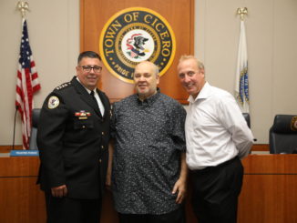 Retiring Cicero Police Chief Jerry Chlada Jr., poses with Town President Larry Dominick and Stickney Police Chief James Sassetti following his announcement at the Town Board meeting Tuesday August 23, 2022