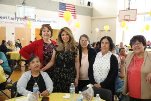 Senior Director Diana Dominick with attendees at the Spring Bingo April 12, 2023