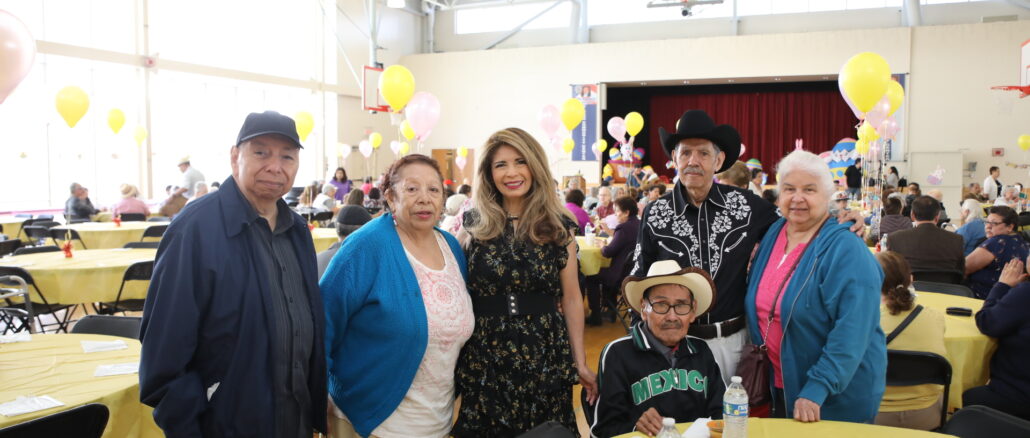 Senior Director Diana Dominick with attendees at the Spring Breakfast Bingo April 12, 2023