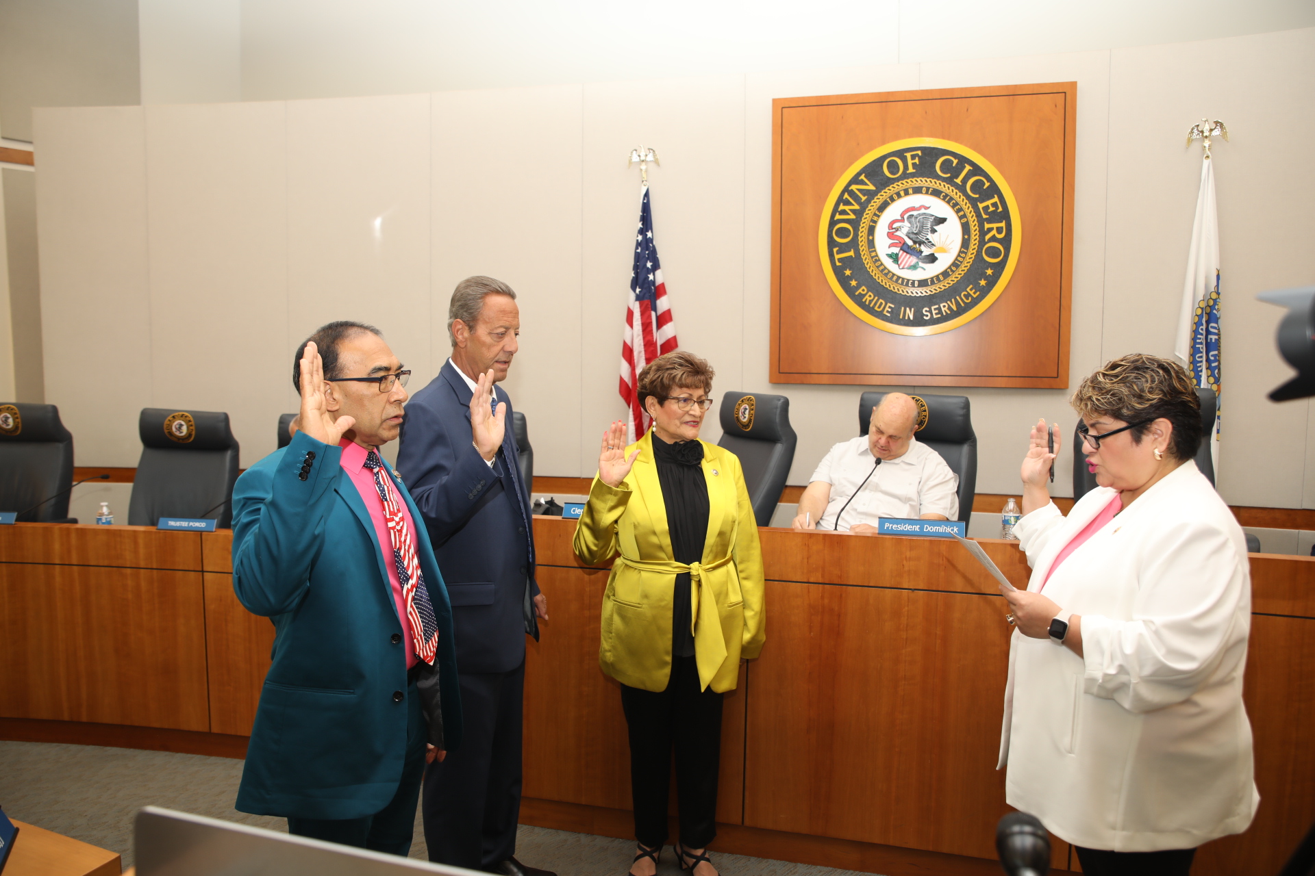 Town Clerk Maria Punzo-Arias administers the Oath of Office to Trustees Victor Garcia, John Cava and Blanca Vargas at the board meeting on May 9, 2023