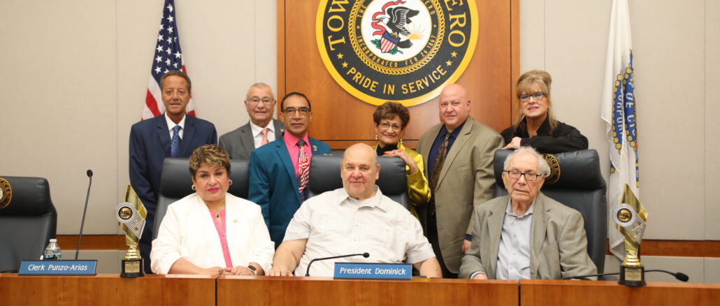 President Dominick celebrates his 18th year in office with the town's elected officials at the board meeting May 9, 2023