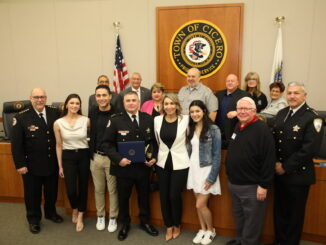 Dep. Superintendent Frank Diaz with Town officials and family at the April 28 board meeting where he was recognized for his service in the U.S. Military Reserves