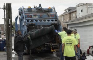 Public Works employees working 24/7 to help clear alleys of bulk refuse in wake of floods