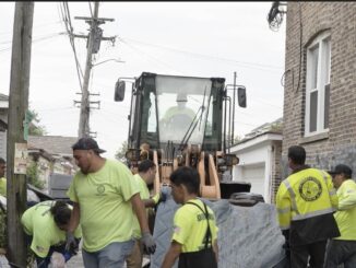Public Works employees working 24/7 to help clear alleys of bulk refuse in wake of floods
