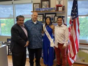 Town President Larry Dominick and Cook County Commissioner Frank Aguilar greet Miss Teen 2024 competitor Emily Apango and her father.